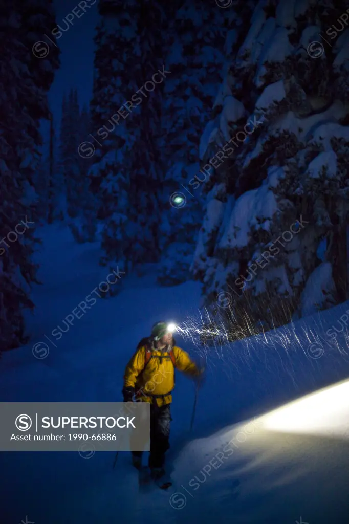A man coming back from a late day of ski touring, Sol Mountain Lodge, Monashee Backcountry, Revelstoke, BC