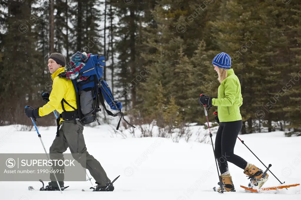 A young outdoorsy family going for a snowshoe at Peter Lougheed Provincial Park, Kananaskis, AB