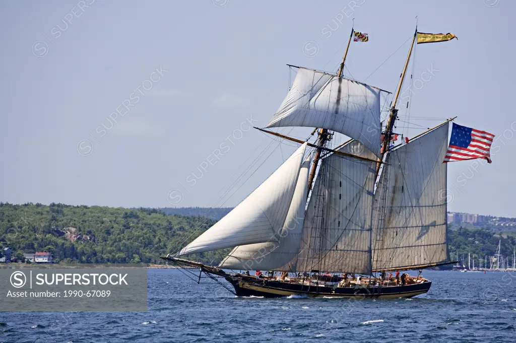 Sailing ship Pride of Baltimore II departs Halifax Harbour during the Parade of Sail conclusion of the 2012 Tall Ships festival in Halifax, Nova Scoti...