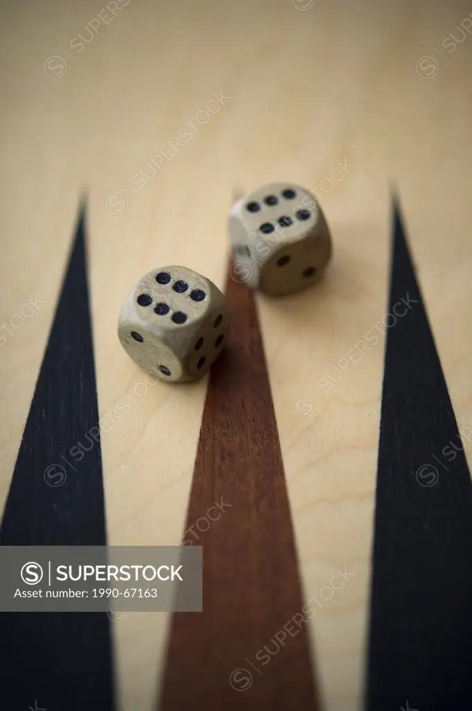 Backgammon dice lying on the playing field