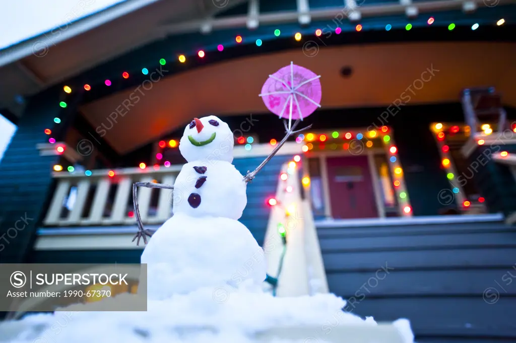 Festive snowman and Christmas lights.