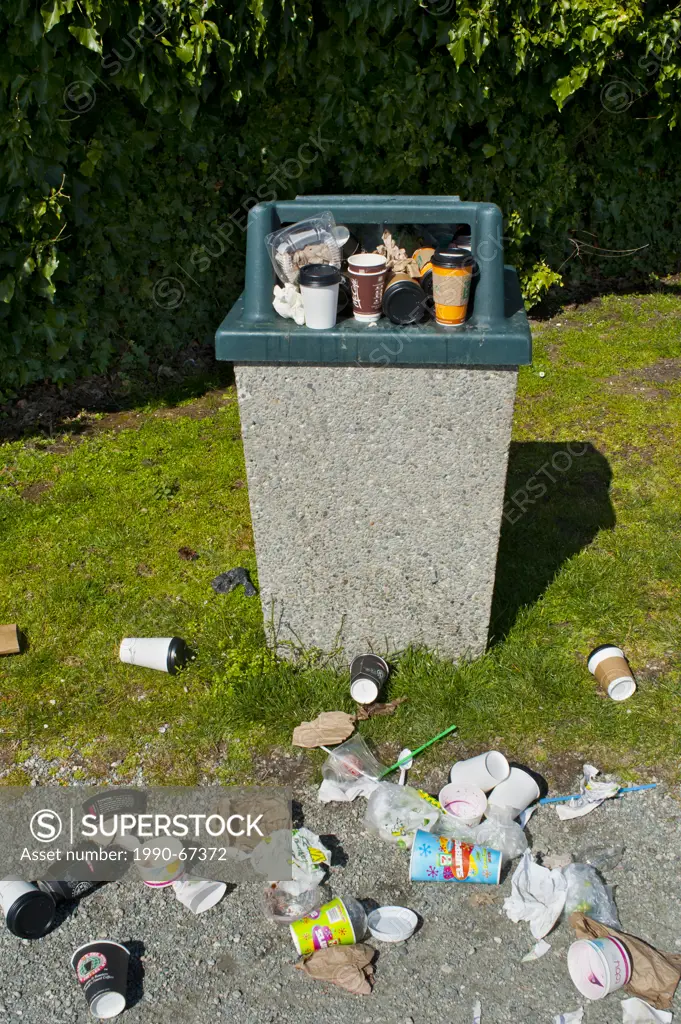 Overfilled public garbage container.