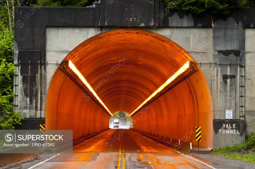 Sodium vapor lights used to illuminate a tunnel.