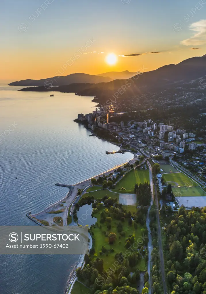 West Vancouver shoreline at sunset with Ambleside Park in foreground.