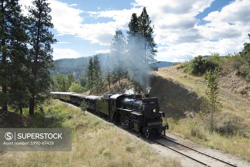 The Kettle Valley Railway, lead by locomotive 3716 steams through Summerland, BC, Canada.