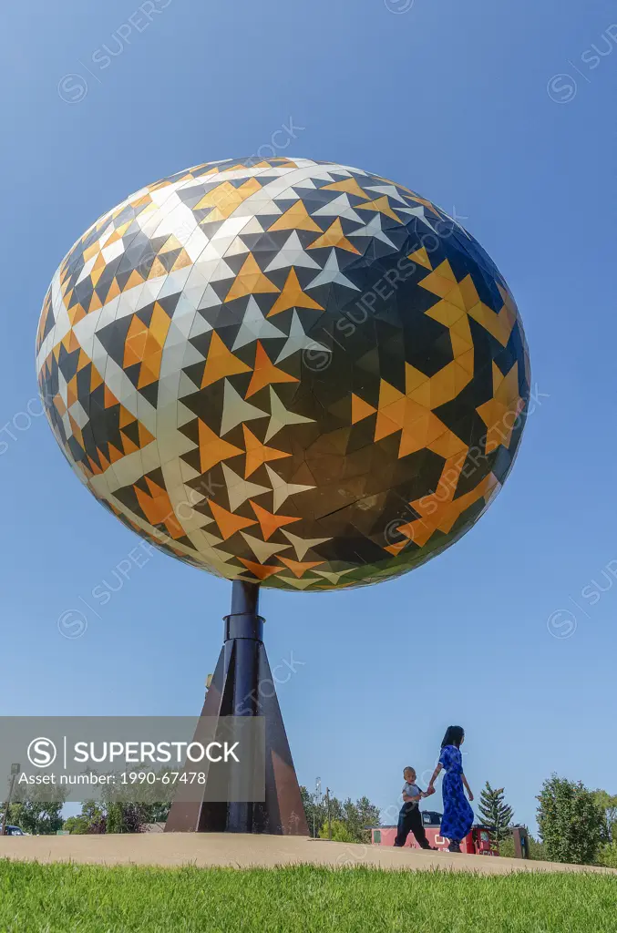 Mennonite children at the Vegreville egg, a giant sculpture of a pysanka, a Ukrainian style Easter egg. It is the largest pysanka in the world. Vegrev...