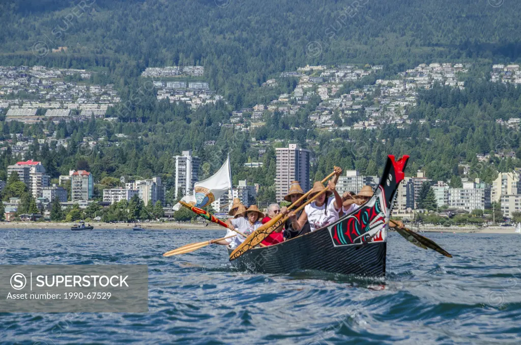 Salish canoes leaves Ambleside Beach, West Vancouver at Many People, One Canoe. Salish First Nations, Gathering of Canoes to Protect the...