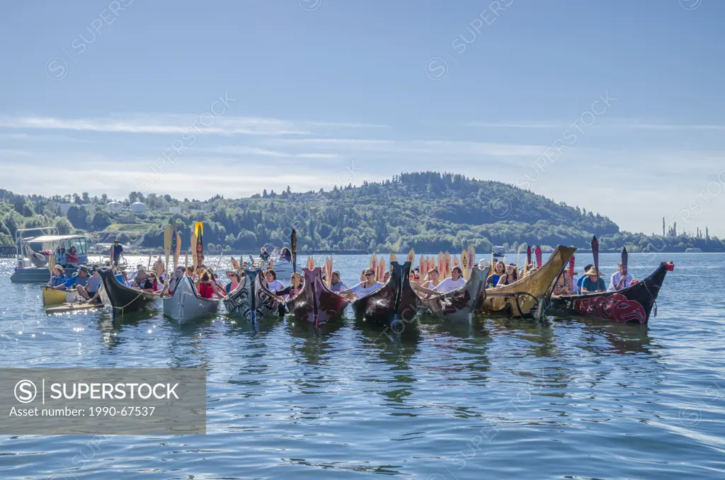 First Nations canoes protest Oil Tanker traffic at Kinder Morgan pipeline terminal Burrard Inlet, during Many People, One Canoe. Salish First Nations,...