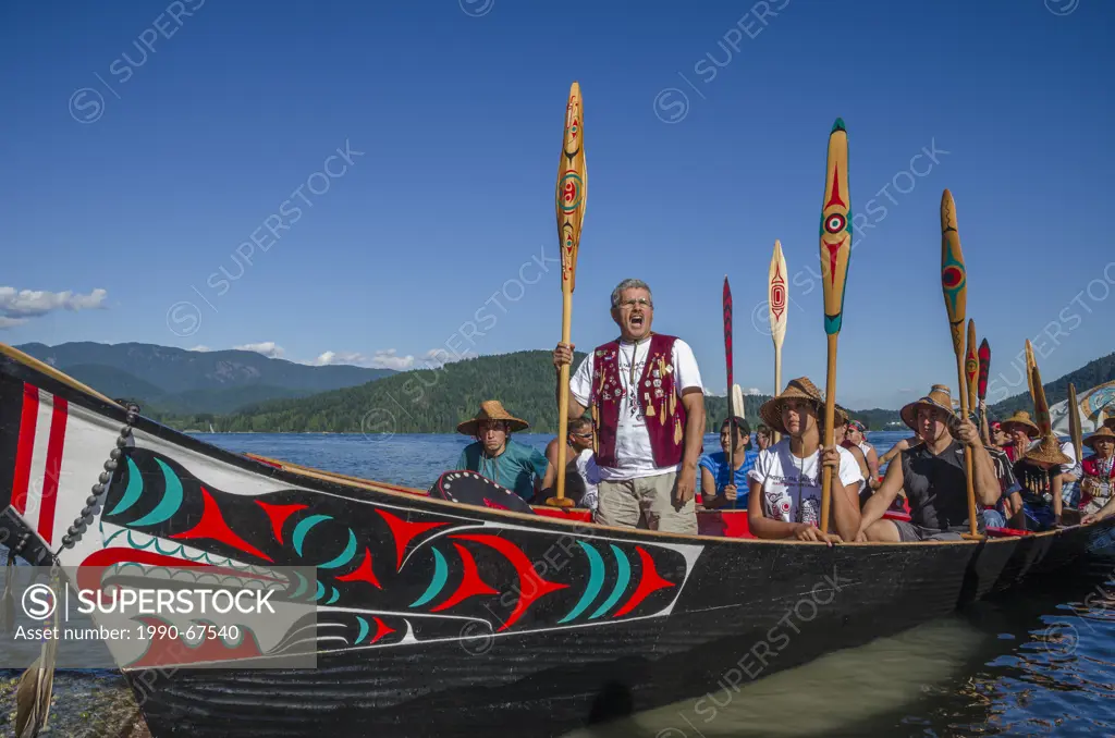 Paddlers being welcomed at Whey_ah_Wichen Cates Park N. Vancouver, BC, Canada. Many People, One Canoe. Salish First Nations, Gathering of Canoes to Pr...