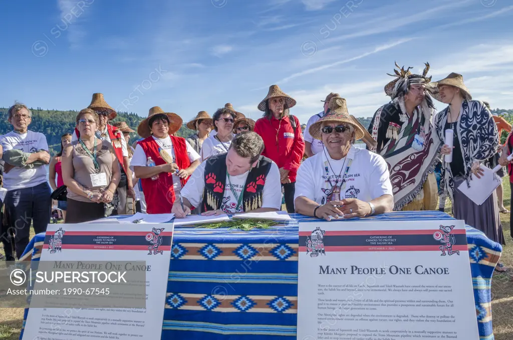 Chief Justin George of Tsleil_Waututh Nation and Chief Gibby Jacob of Squamish Nation sign a historic declaration to protect the Salish Sea.Many Peopl...