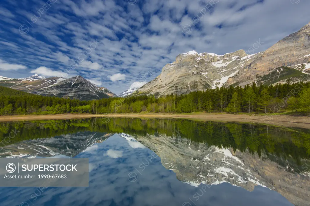 Mountains reflected in Wedge Pond, Kananaskis Provincial Park, Alberta, Canada