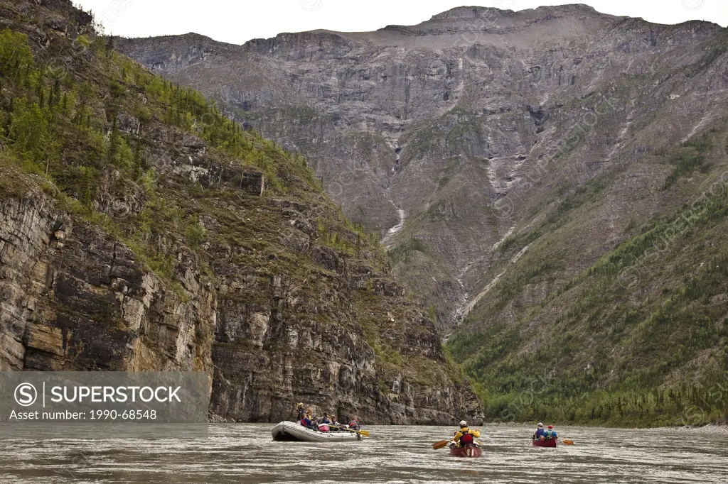 Two canoes and raft on Nahanni River, Nahanni National Park Preserve, NWT, Canada.
