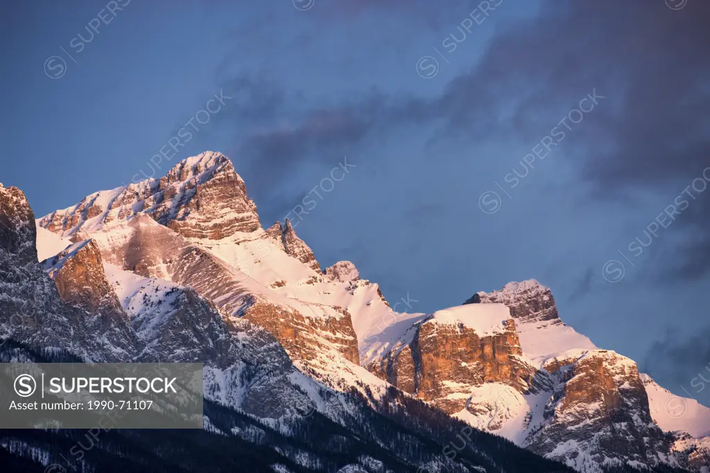 Sunrise on Three Sisters mountains above, Canmore, Alberta, Canada