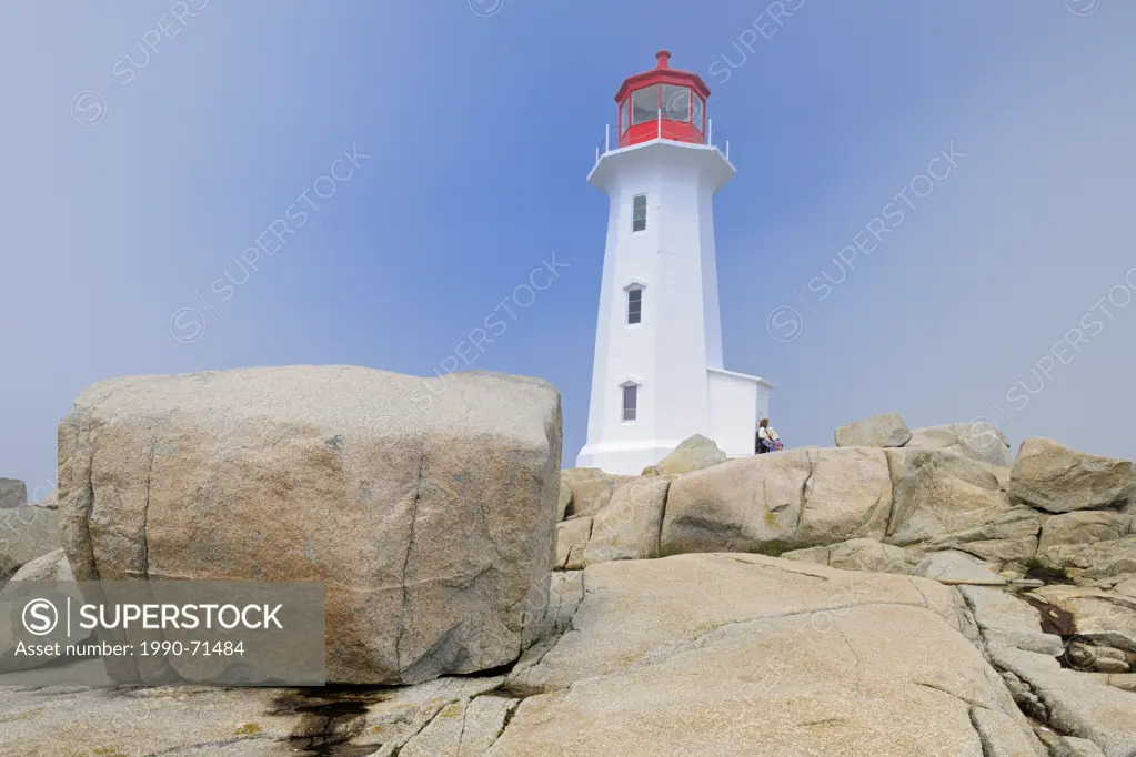 Lighthouse and rocky shoreline, Peggys Cove, Nova Scotia, Canada