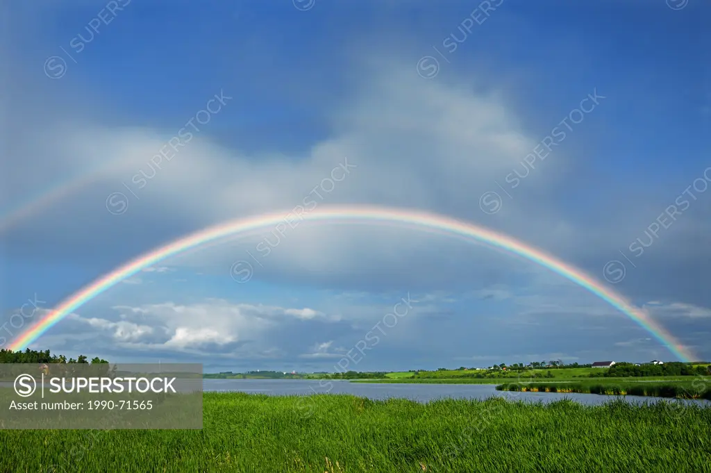 Rainbow after storm in Lac St. Jean area, ,St Gedeon, Quebec, Canada