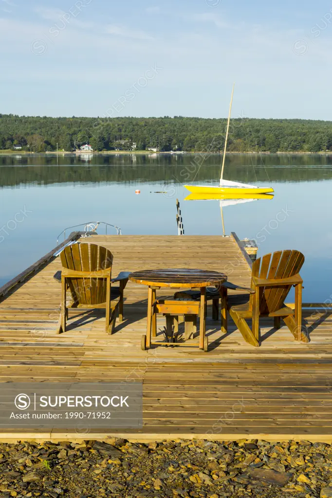 Adirondack chairs on wharf, Little Island, LaHave River, Nova Scotia, Canada