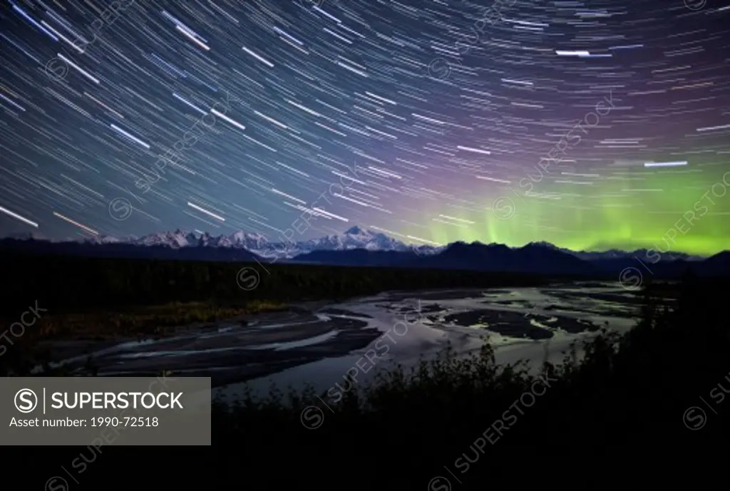 Star trails and aurora borealis over Denali (Mount McKinley), Denali National Park, Alaska, United States of America.