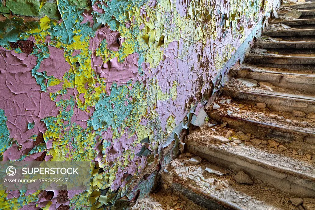 Stairs and Wall with Peeling Paint in an Abandoned Building