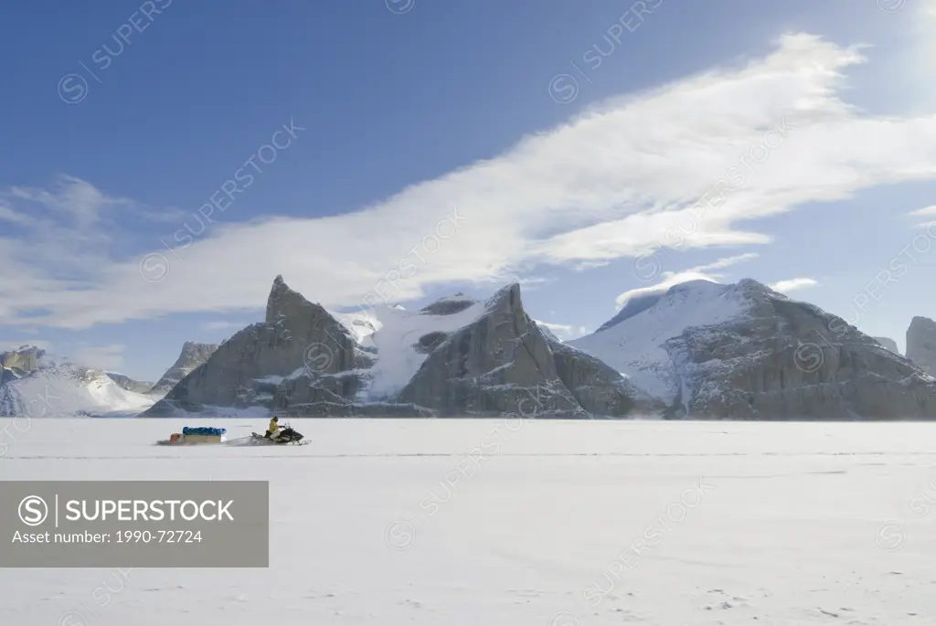 Inuit snowmobiler, Sam Ford Fiord, Baffin Island, Nunavut, Canada