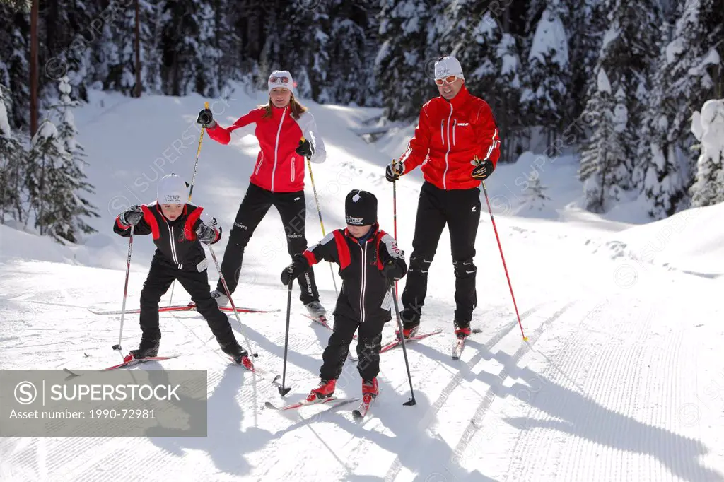 Young family Cross Country Skiing at Sovereign Lake Nordic Centre, near Vernon, Okanagan, British Columbia, Canada