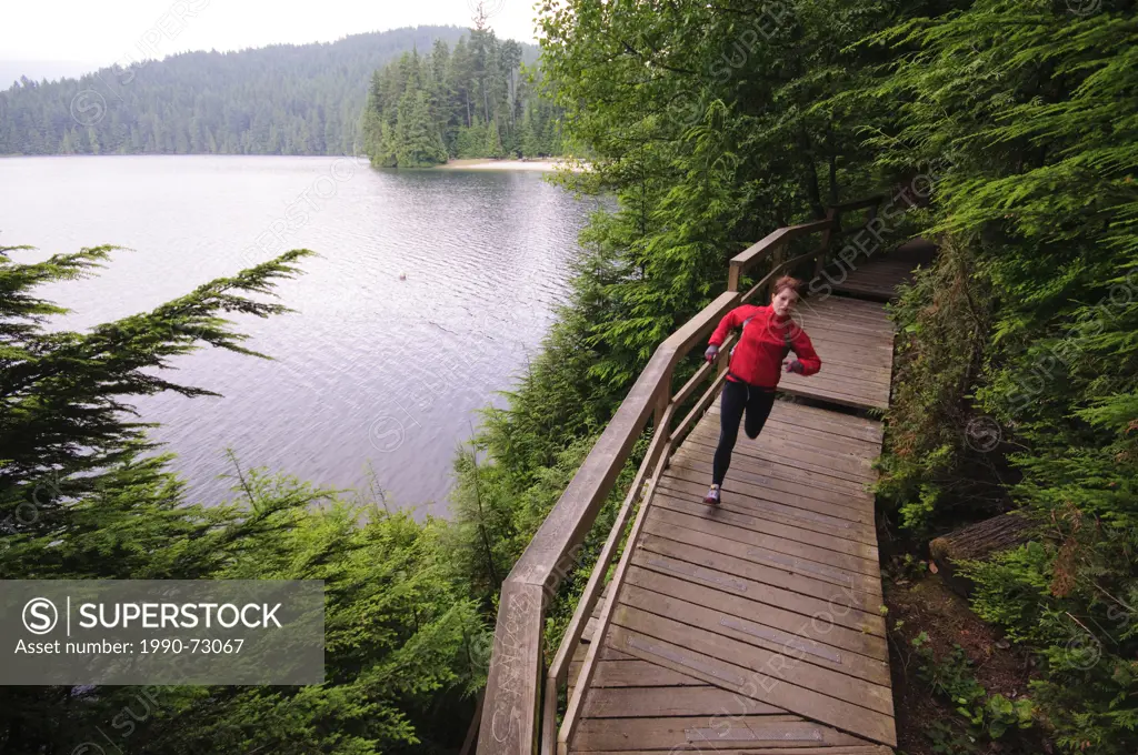 Running and hiking on the trail around Sasamat Lake, Belcarra Regional Park, Port Moody, British Columbia, Canada