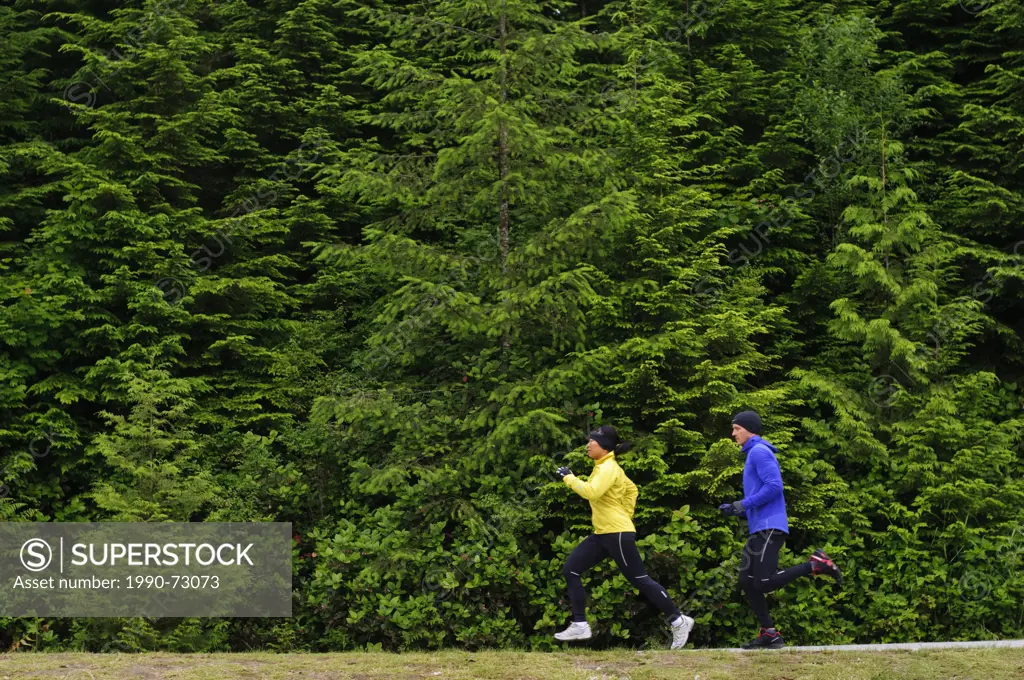 Running and hiking on the trail around Sasamat Lake, Belcarra Regional Park, Port Moody, British Columbia, Canada