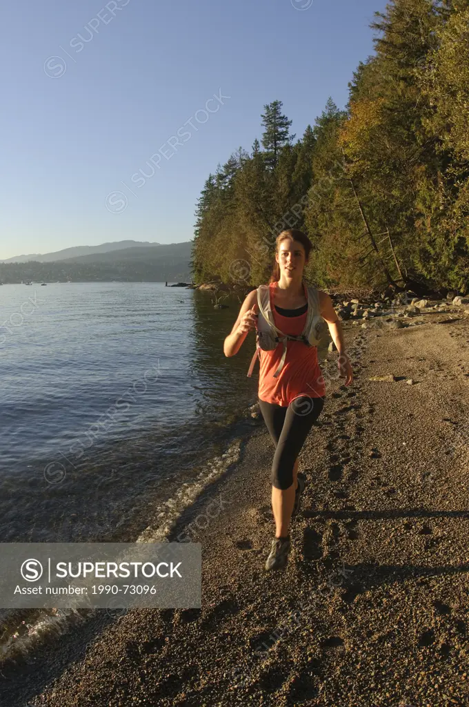 Running the Admirality Trail in Belcarra Regional Park. Port Moody, British Columbia, Canada