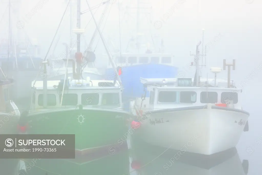 Fishing boats in fog at North Head, Grand Manan Island, New Brunswick, Canada