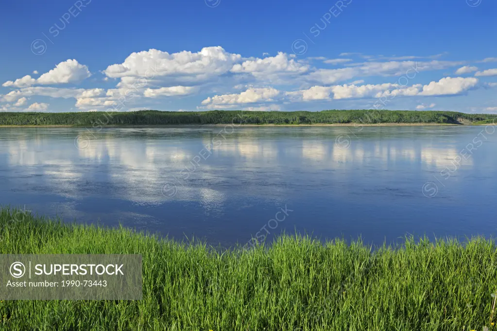 Clouds reflected in the Mackenzie River, Ft. Simpson, Northwest Territories, Canada