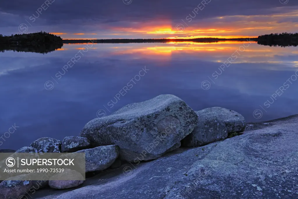 Setting sun before a storm, White Lake, Whiteshell Provincial Park, Manitoba, Canada