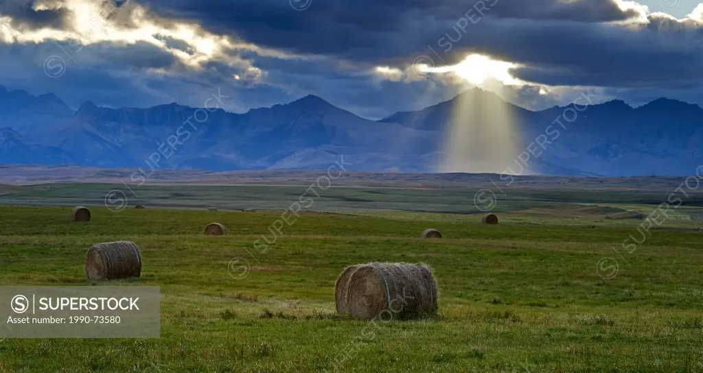 Crepuscular rays, God rays, haybails, Southern Alberta, Canada