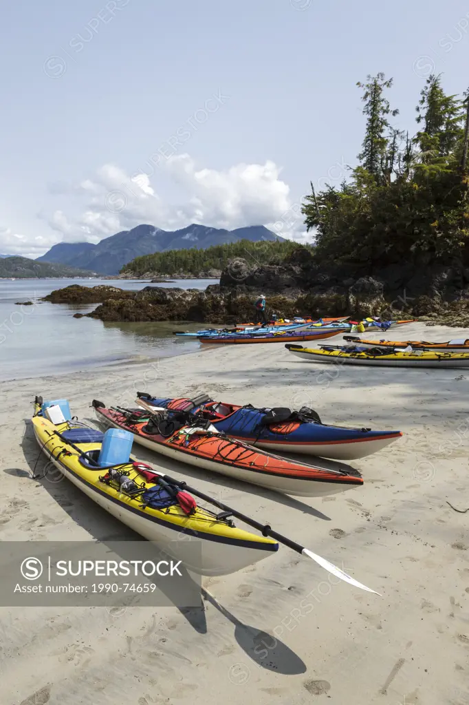 A group of kayakers arrive at Rosa Island in Nutchatlitz Provincial Park on British Columbia's west coast, Canada.