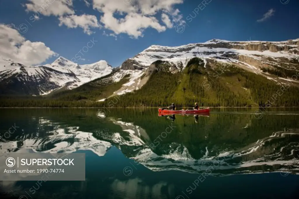 Couple in canoe, Maligne Lake, Jasper National Park, Alberta, Canada.