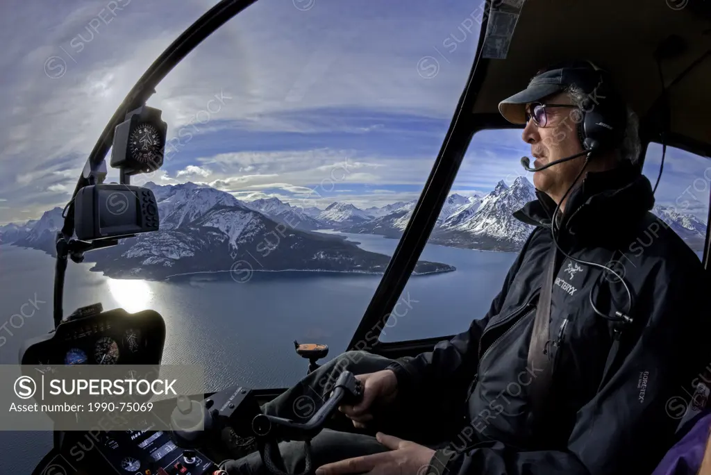 Helicopter pilot, Chilko Lake, Coast Mountains, British Columbia, Canada