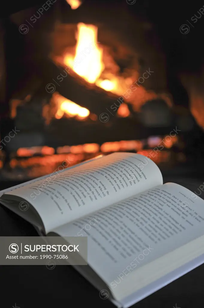 Open book by a fireplace
