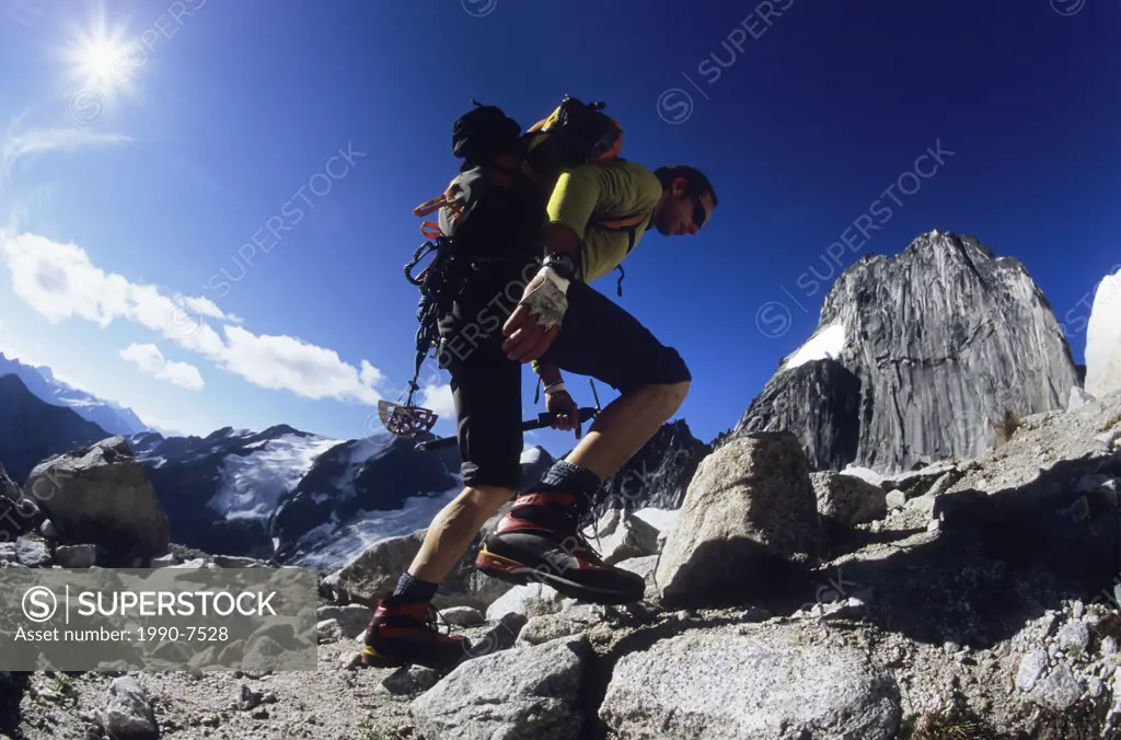 A young man making his way in the Bugaboos, British Columbia, Canada