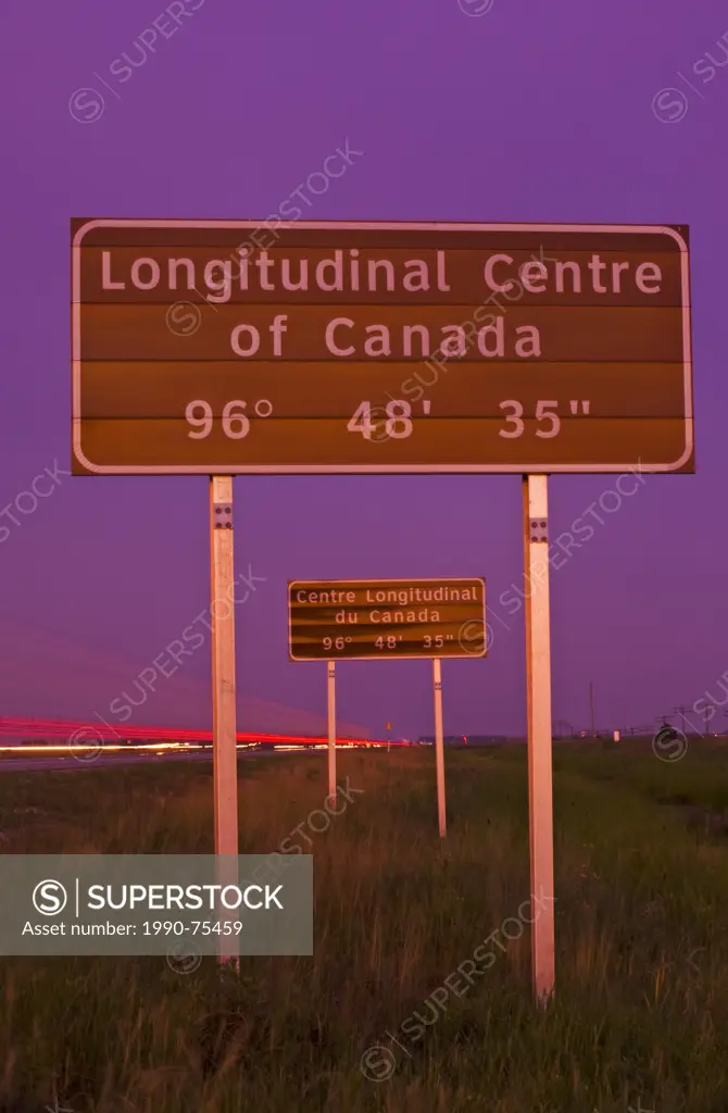 signage along Trans-Canada Highway east of Winnipeg to mark what is the longitudinal center of Canada , Manitoba, Canada