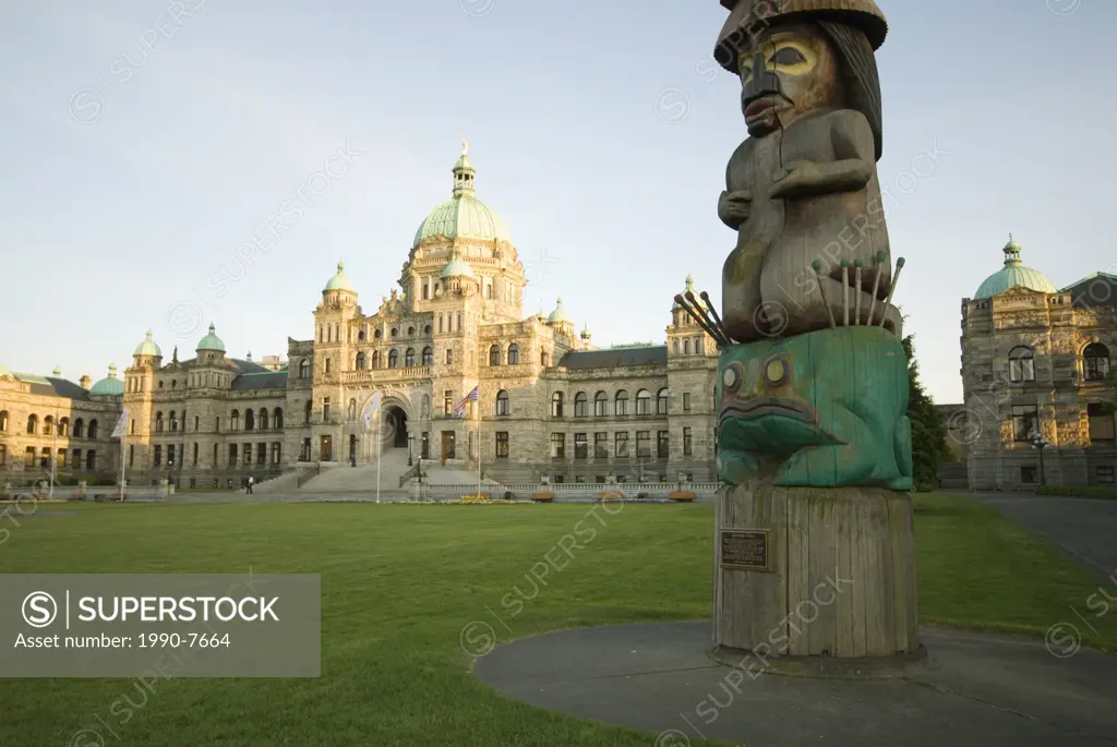 A totem pole stands on the front lawn of the Legislature in Victoria, Vancouver Island, British Columbia, Canada