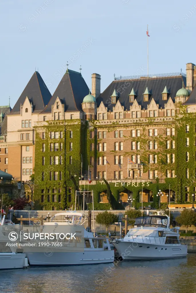 The Empress Hotel and boats moored at the harbour in Victoria, Vancouver Island, British Columbia, Canada