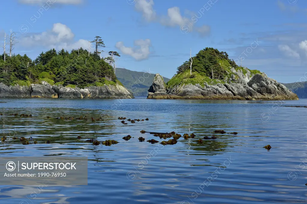 Calm seas and rocky outer islands near Anthony Island (SGang Gwaay), Haida Gwaii (Queen Charlotte Islands) Gwaii Haanas NP, British Columbia, Canada