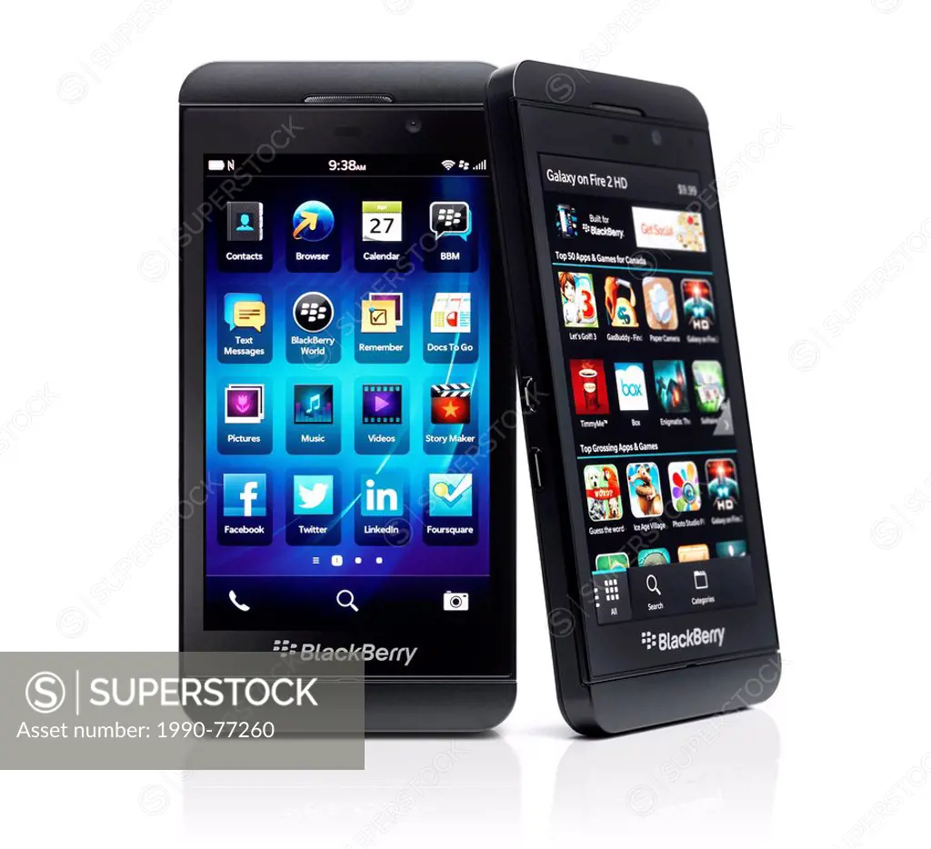 Two Blackberry Z10 smartphones with desktop and app store on display. Black phones isolated on white background with clipping path