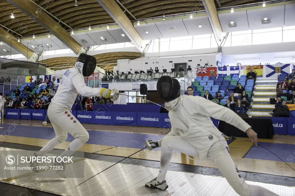 Marc-Andre Leblanc (CAN) scoring point on the New Zealand fencer at Vancouver Grand Prix of Men's Epee 2013 at Richmond Olympic Oval. Richmond, Britis...