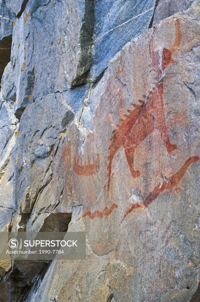 Agawa Rock red ochre pictographs, believed painted by Ojibwa shaman artists in 17th and 18th centuries, are part of native cultural heritage  Painting...