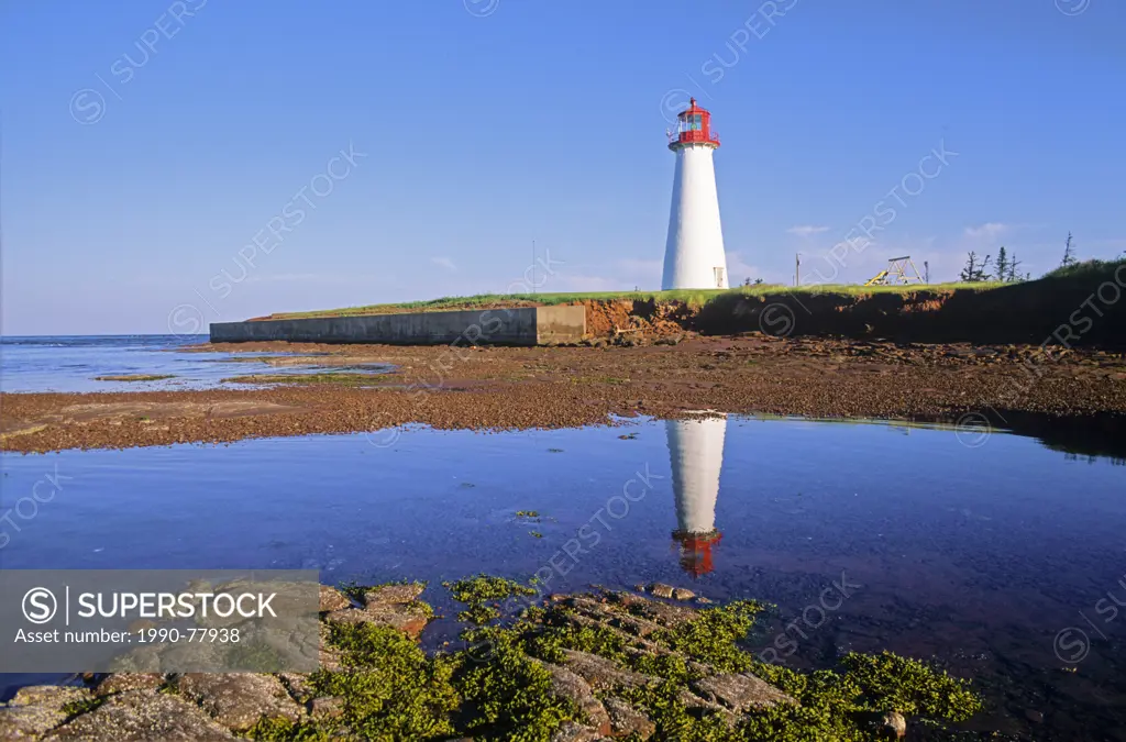 Point prim Lighthouse reflected in tidal pool, Point Prim, Prince Edward Island, Canada