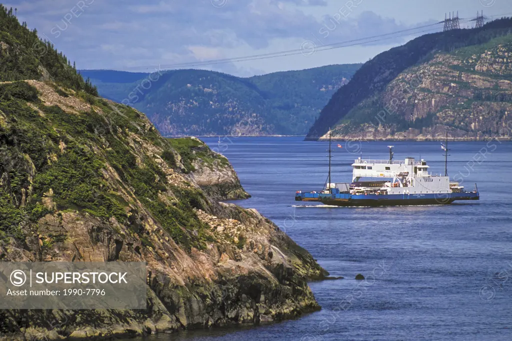 Ferry crosses the mouth of the Saguenay River where it meets the St  Lawrence River between the towns of Baie-Sainte-Catherine and Tadoussac on the no...