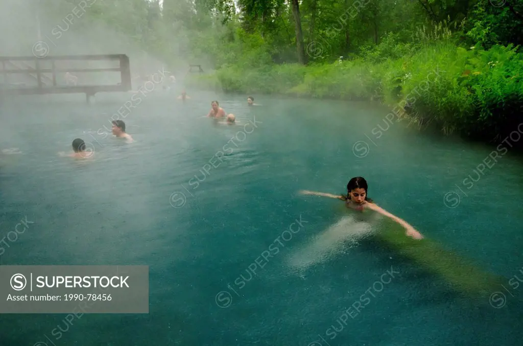 Bathers soak in the Liard River Hotsprings, Northern British Columbia, Canada