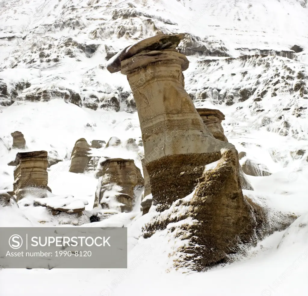 Fresh snow on badlands and hoodoo formations, Drumheller, East Coulee, Alberta, Canada