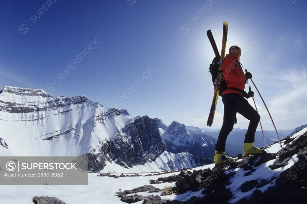 A skier boot packing up to the summit, Grassi Peak, Canmore, Alberta, Canada