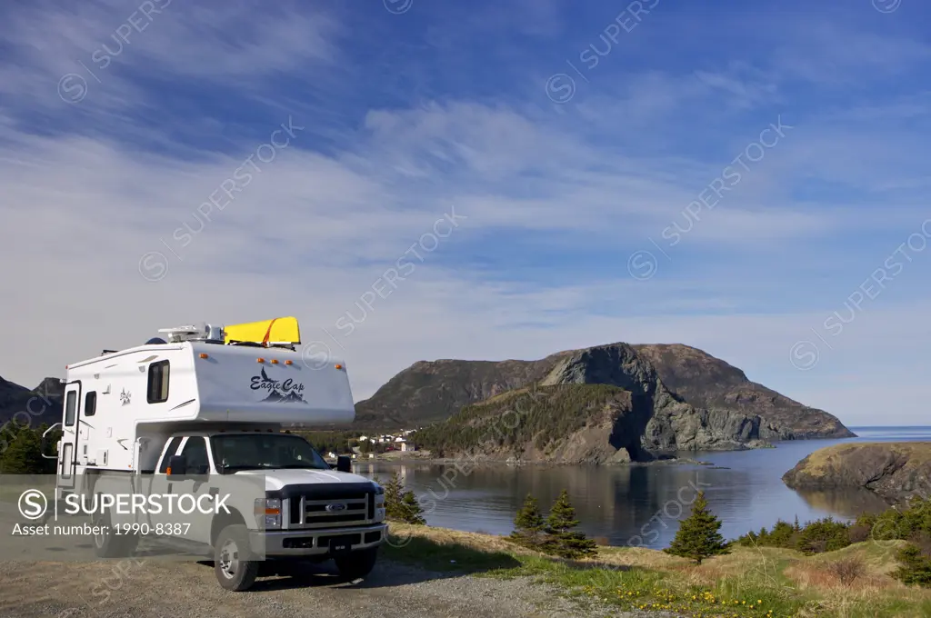Camper parked an open area in Bottle Cove at the end of the Humber Arm near Lark Harbour, Newfoundland & Labrador, Canada