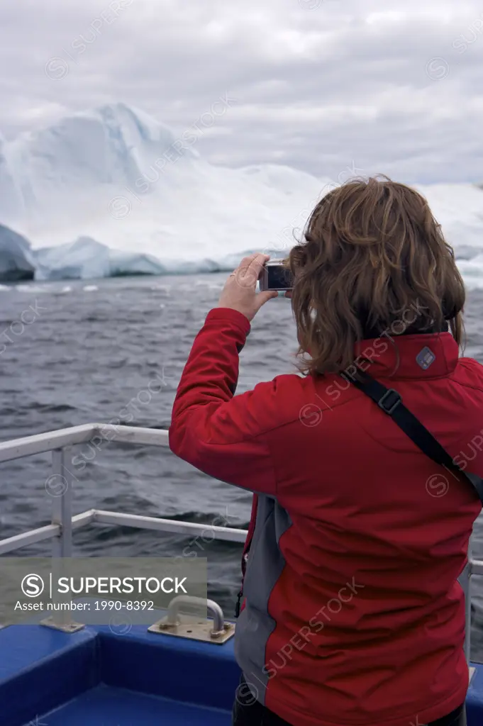 Tourist onboard the Gaffer III during an Iceberg Watching tour with Northland Discovery Boat Tours from St Anthony into Iceberg Alley, Viking Trail, G...